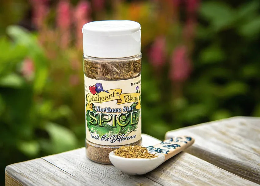 Northern Star seasoning jar and spoon on weathered wood in a garden