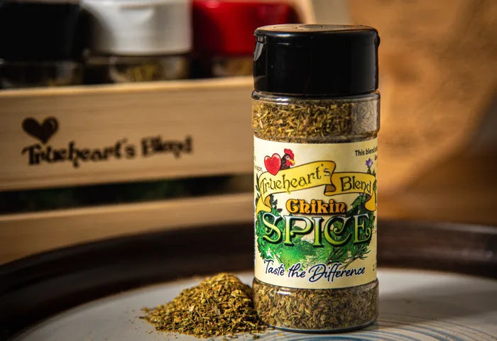 Seasoning for Chikin in its current slim bottle with loose seasoning on a wooden display